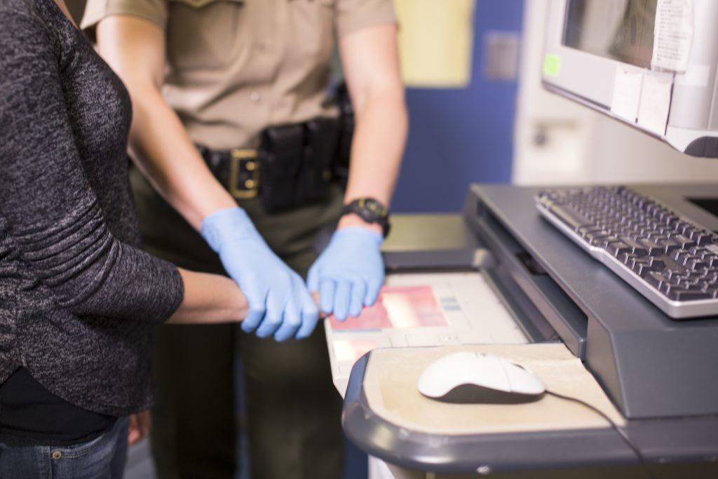 Kentucky jail booking station showing criminal processing area, representing arrest procedures and criminal defense documentation