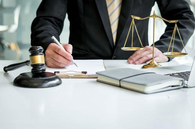 Criminal defense attorney in Kentucky examining case documents and legal files for defense strategy development